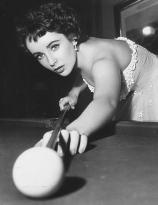 Elizabeth Taylor playing pool in 1951