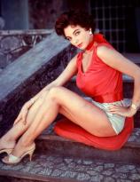JoanCollins sitting on the stairs