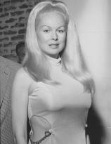 Joi Lansing in a swinging sixties party dress
