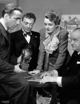 Humphrey Bogart, Peter Lorre, Mary Astor, Sydney Greenstreet in a production still from The Maltese Falcon (1941)