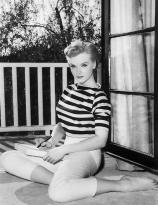 Anne Francis sits on the balcony