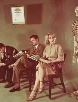 Jack Lemmon, Aldo Ray and Marilyn Monroe pose with a skeleton for Colliers Magazine in 1951