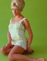 Elke Sommer on a green background