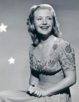 Priscilla Lane star background pose