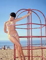 Yvonne Craig plays on the beach