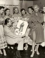 Cartoonist Milton Caniff drawing at Real Life Model Bek Stiner, 1952