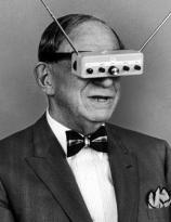 Inventor and publisher Hugo Gernsback demonstrates his television goggles in 1963