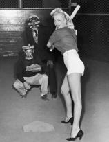 Marilyn Monroe plays baseball in heels