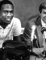 Michael Jordan at a press conference with Dean Smith, 1984