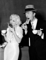Jean Harlow and William Powell grab a bit of breakfast on the set of Reckless (1935)