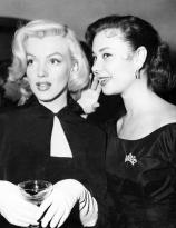 Marilyn Monroe and Mitzi Gaynor at Sheila Grahams wedding, 14th February 1953.