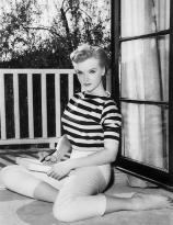 Anne Francis sits on the balcony